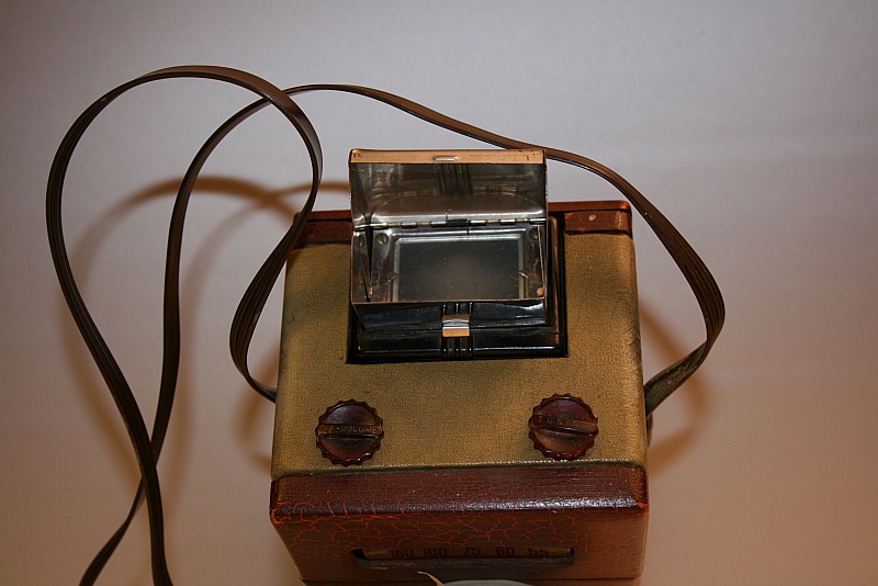 Il mirino della fotocamera, il comando del volume e della sintonia